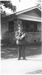 My dad with his pet dog in front of his boyhood home in East Lake 